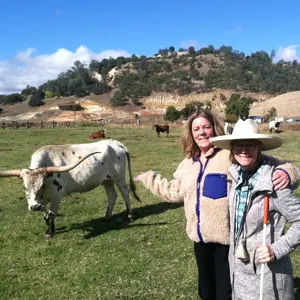 TSF CEO Elizabeth Martin and Ione Valley LAWDA co-founder Sondra West-Moore at Westhaven Ranch. 50 year old un-reclaimed mining scars are visible in the background.