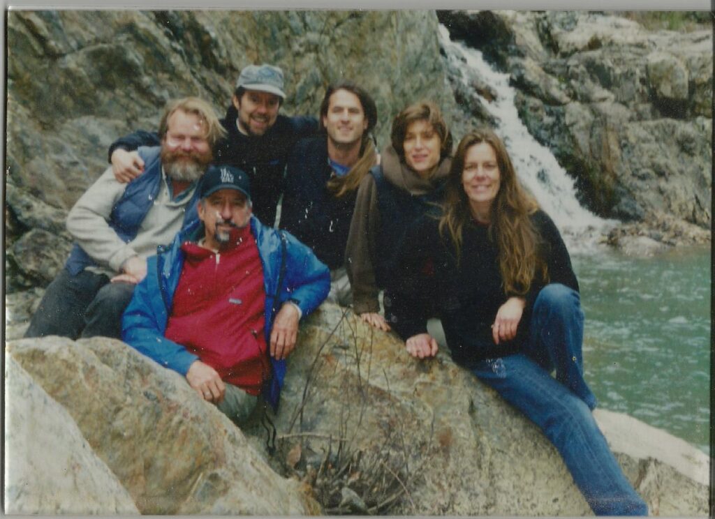 Six early Sierra Fund leaders gathered beside a Sierra Nevada waterfall